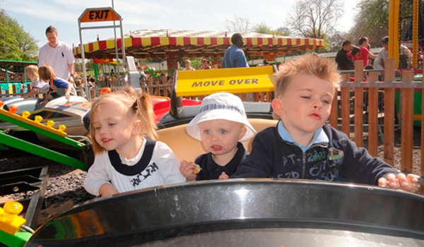 Kids enjoying a fair ground ride at clifton park